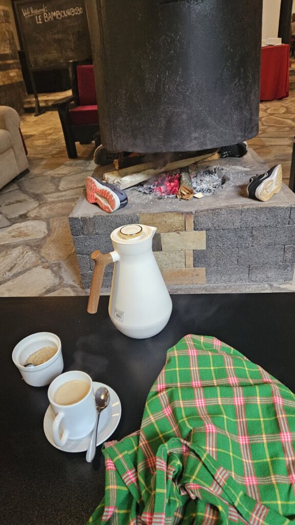 African tea in Volcanoes National Park Le Bambou Lodge, in Rwanda, with our shoes drying next to the fire place...