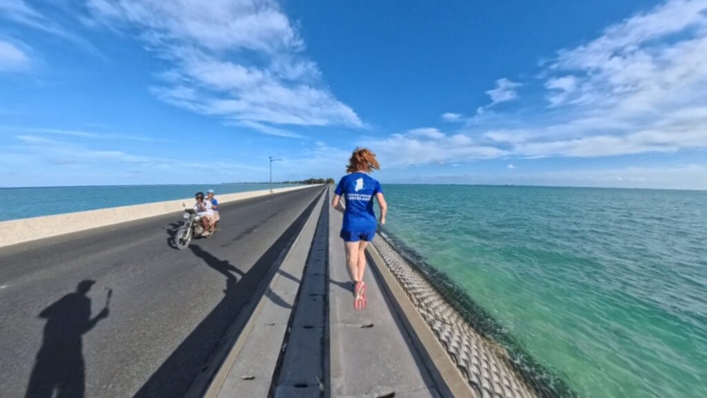 Images of our run in Betio, Kiribati in 2025. The running ginger running in the Betio - Bairiki Highway in Kiribati.