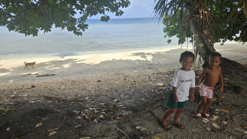 Scenic image of Tuvalu with local kids, the least visited country of the world, in the Pacific, in September 2025.