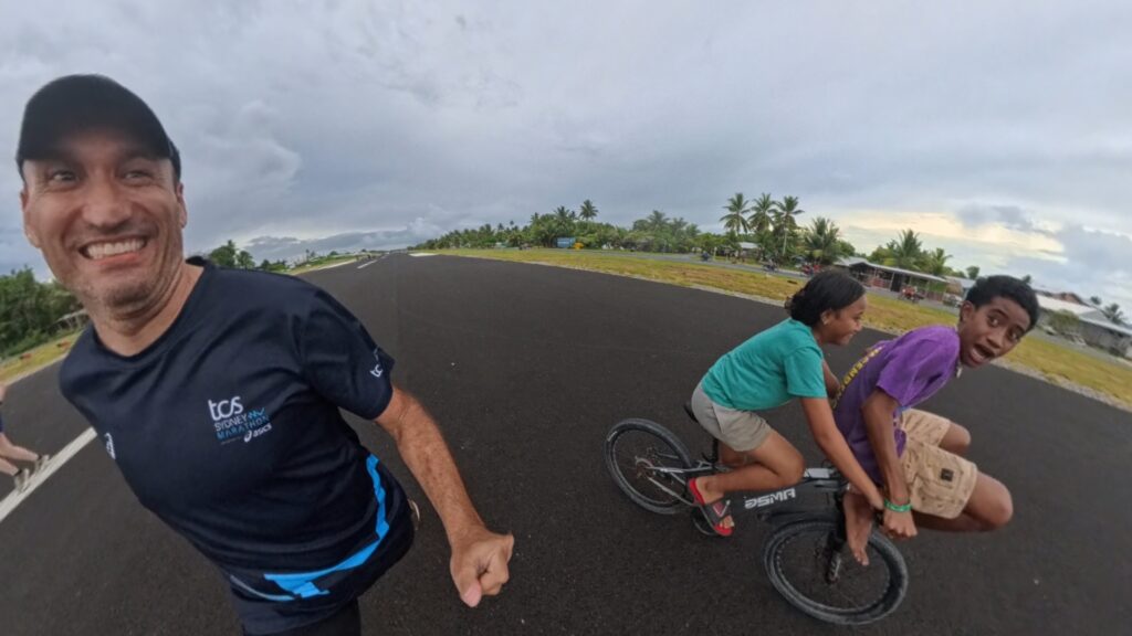The running ginger running in Tuvalu, the least visited country of the world. Images of her 10k run in Funafuti.