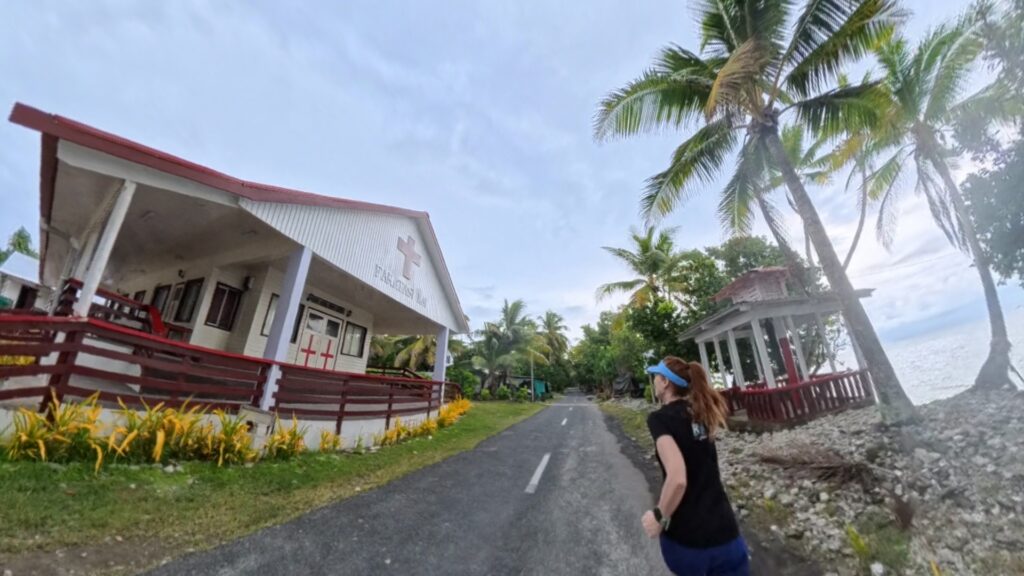The running ginger running in Tuvalu, the least visited country of the world. Images of her 10k run in Funafuti.