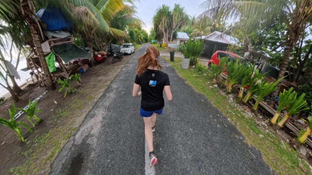The running ginger running in Tuvalu, the least visited country of the world. Images of her 10k run in Funafuti.