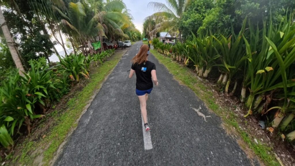 The running ginger running in Tuvalu, the least visited country of the world. Images of her 10k run in Funafuti.