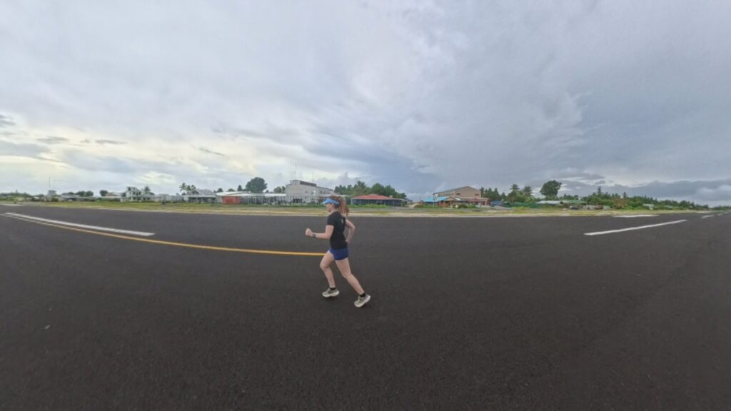 The running ginger running in Tuvalu, the least visited country of the world. Images of her 10k run in Funafuti.