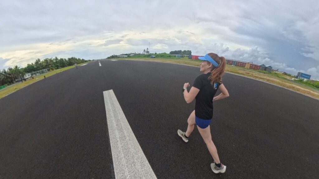 The running ginger running in Tuvalu, the least visited country of the world. Images of her 10k run in Funafuti.