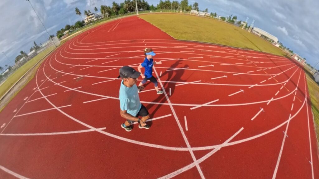 The running ginger running in the Track and Field Stadium in the Majuro Atoll in the Marshall Islands in 2025