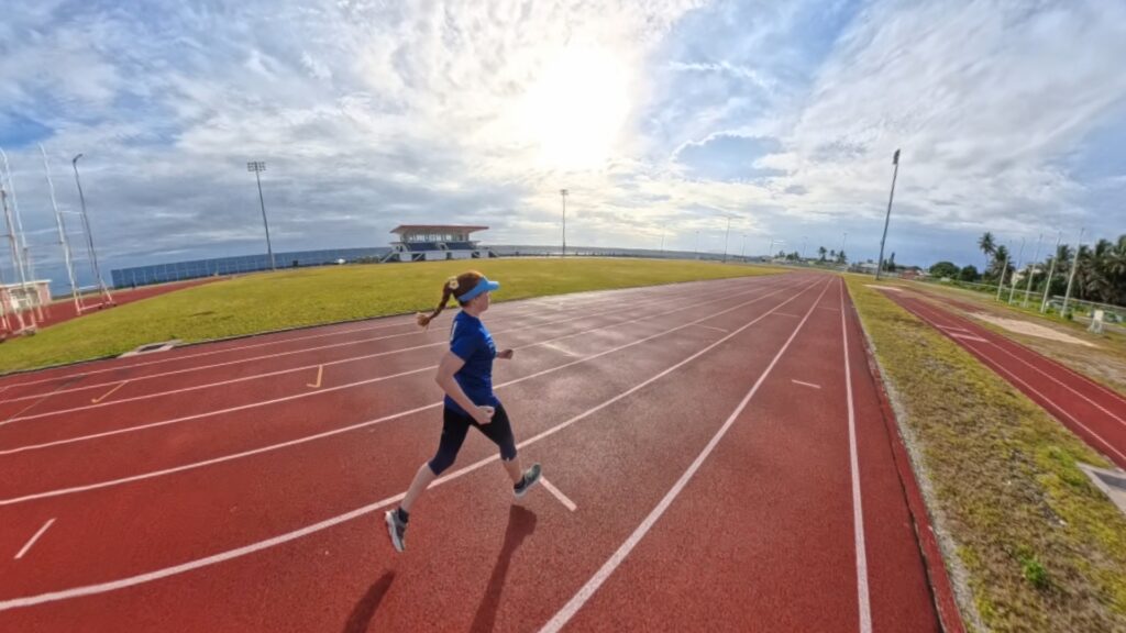 The running ginger running in the Track and Field Stadium in the Majuro Atoll in the Marshall Islands in 2025