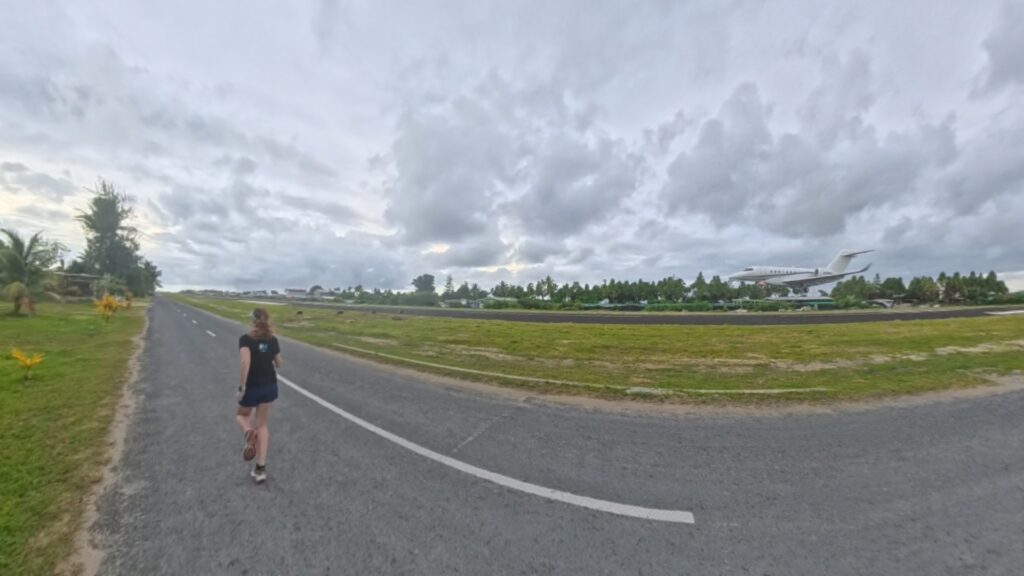 The running ginger running in Tuvalu, the least visited country of the world. Images of her 10k run in Funafuti.