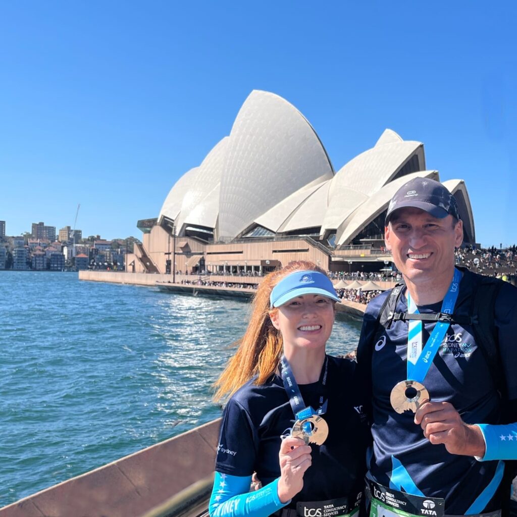 The running ginger and Roger at the Sydney Marathon 2025 with their medals