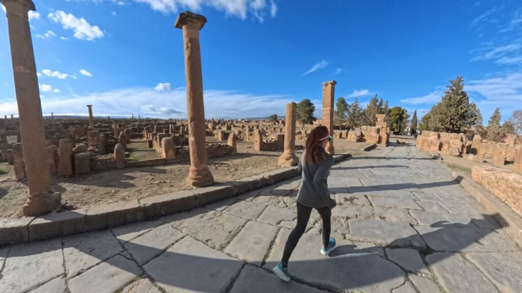 The running ginger running inside the ruins of Timgad, Argelia, in 2026. Recommended route for running and experiencing history at the same time.