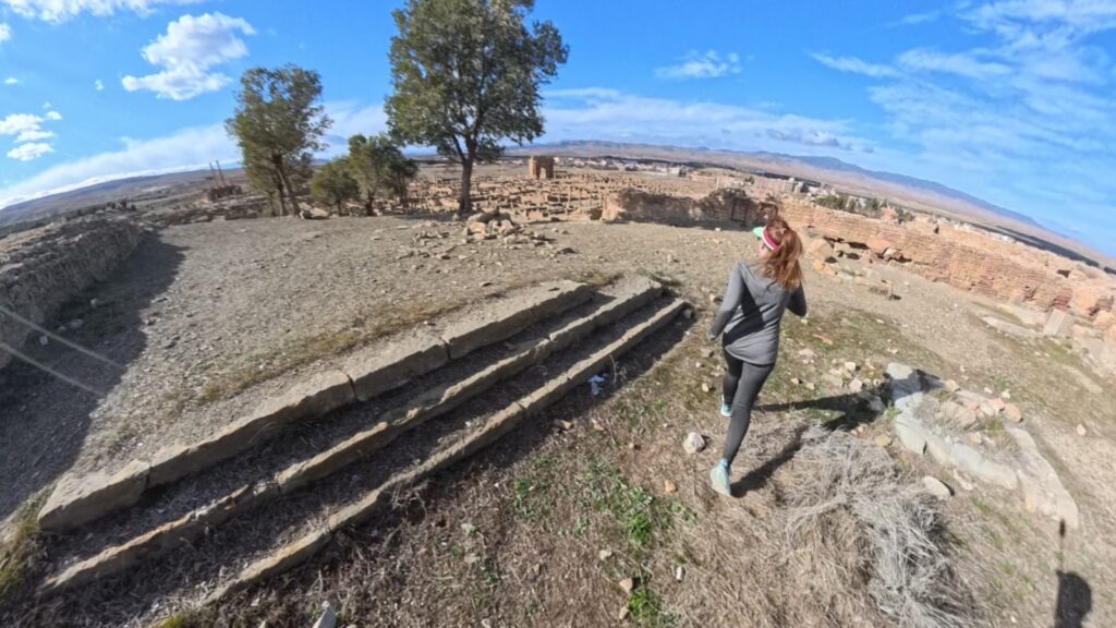 The running ginger running inside the ruins of Timgad, Argelia, in 2026. Recommended route for running and experiencing history at the same time.
