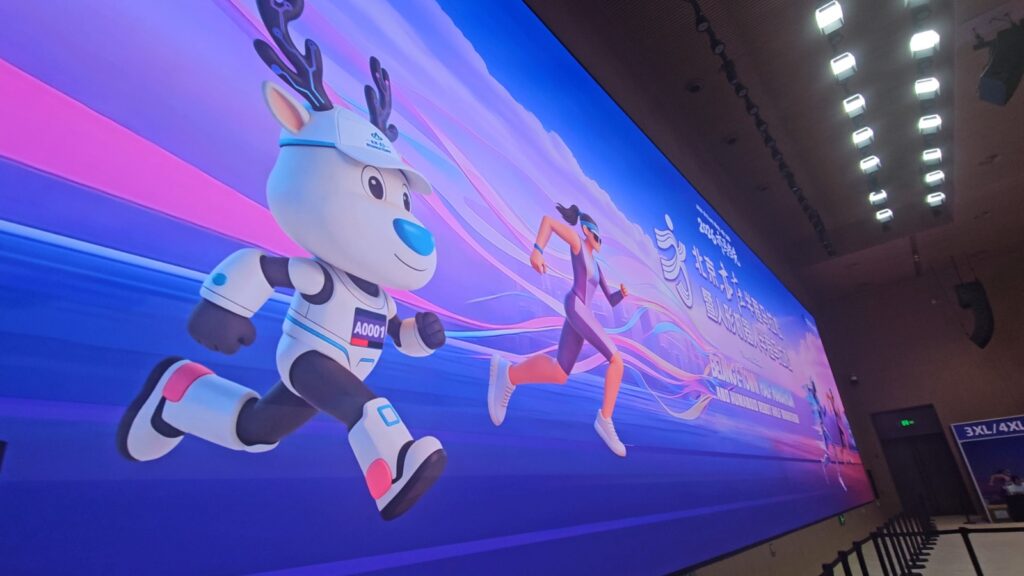 The running ginger running with robots: humanoid robot e-town half marathon in Beijing in 2026