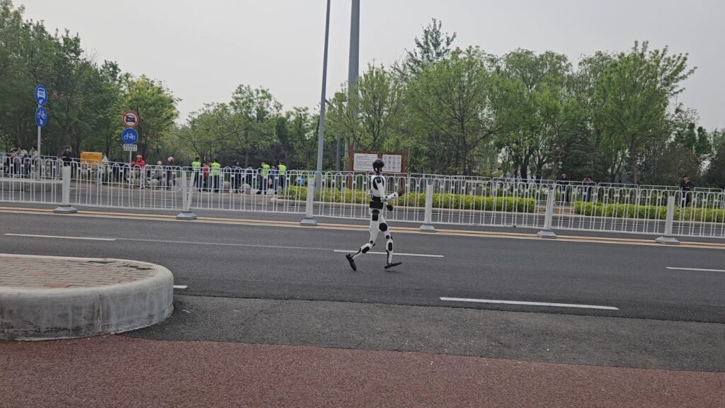 The running ginger running with robots: humanoid robot e-town half marathon in Beijing in 2026