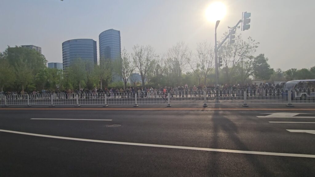 The running ginger running with robots: humanoid robot e-town half marathon in Beijing in 2026