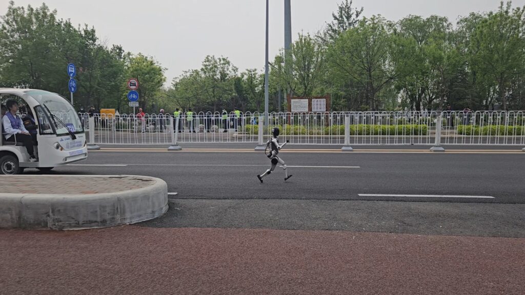 The running ginger running with robots: humanoid robot e-town half marathon in Beijing in 2026